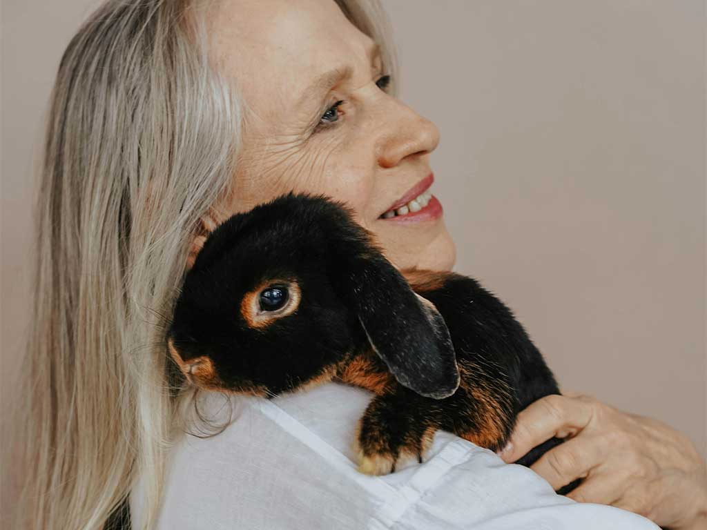 Dog owner walking their pet to improve mental health and wellbeing